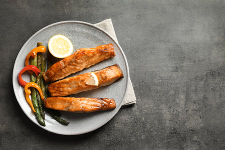 Tasty cooked salmon served for dinner, top viewの写真素材