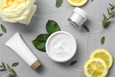 Beautiful composition with cosmetics on gray background, flat lay