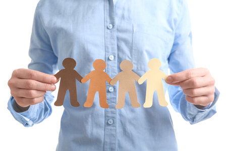 Young woman holding paper people, closeup. unity conceptの写真素材