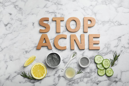 Phrase "Stop acne" and homemade effective problem skin remedies on light background, flat layの写真素材