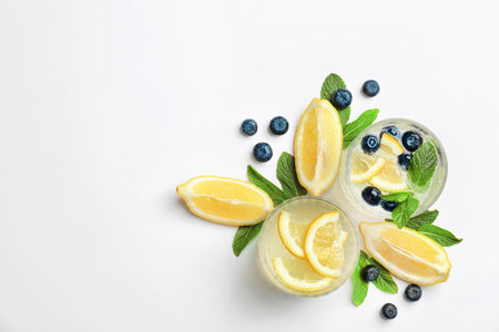 Flat lay composition with delicious natural lemonade on white backgroundの写真素材