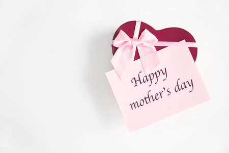 Gift box and card with words "Happy Mother's Day" on light background, top viewの写真素材
