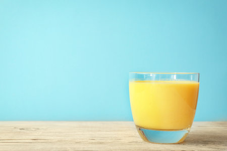 Glass with delicious detox smoothie on tableの写真素材