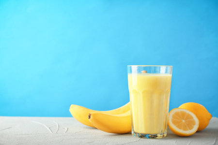 Glass with delicious detox smoothie on tableの写真素材