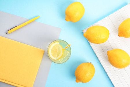 Flat lay composition with delicious natural lemonade on color backgroundの写真素材
