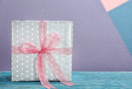 Elegant gift box with bow on tableの写真素材