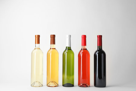 Bottles of expensive wines on light backgroundの写真素材