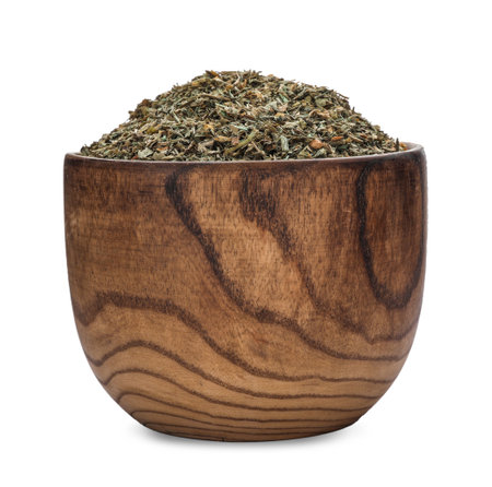 Bowl with dried parsley on white backgroundの写真素材