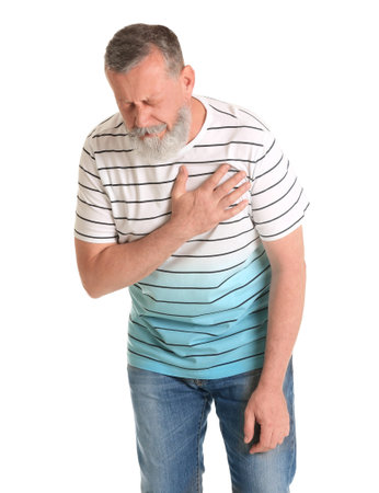 Mature man having heart attack on white backgroundの写真素材