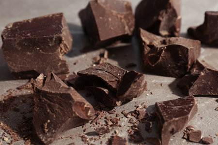 Delicious dark chocolate on gray background, closeupの写真素材