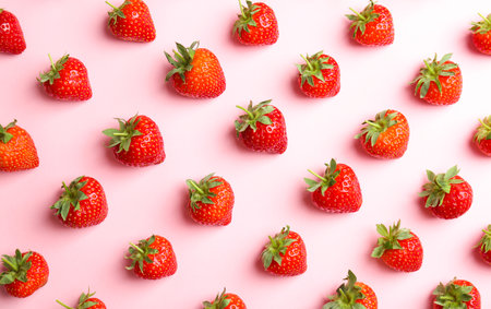 Flat lay composition with tasty ripe strawberries on color backgroundの写真素材