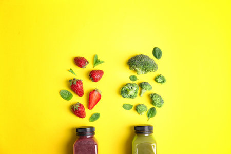 Flat lay composition with healthy detox smoothies and ingredients on color backgroundの写真素材