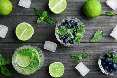 Flat lay composition with detox lemonade and ingredients on wooden backgroundの写真素材