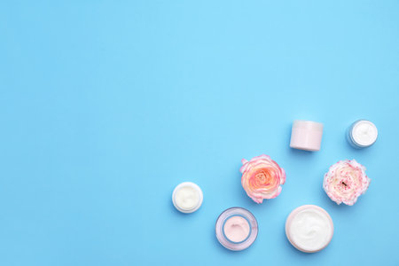 Flat lay composition with cosmetic products on color backgroundの写真素材