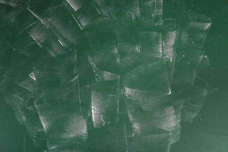 Dirty chalkboard surface with space for textの写真素材