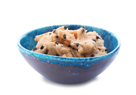 Cookie dough with chocolate chips in bowl on white backgroundの写真素材