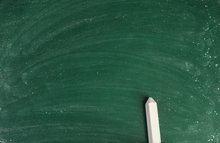 Chalk on green board with space for textの写真素材