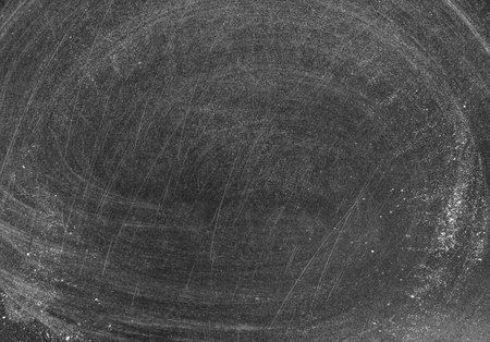Dirty chalkboard surface with space for textの写真素材