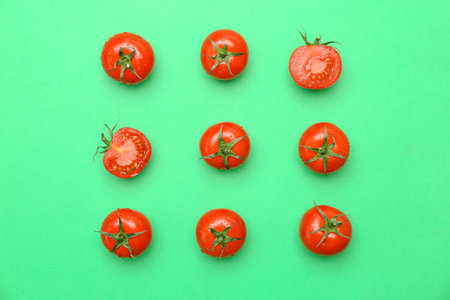 Flat lay composition with ripe tomatoes on color backgroundの写真素材