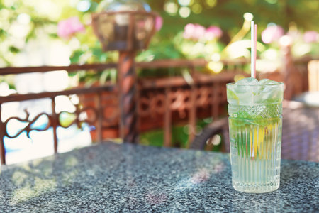 Refreshing tasty lemonade with mint and lemon in glass on table. natural detox drinkの写真素材