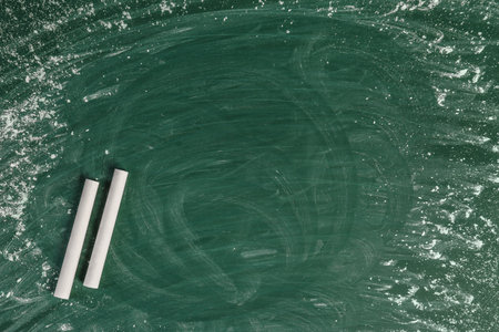 Chalk on green board with space for textの写真素材