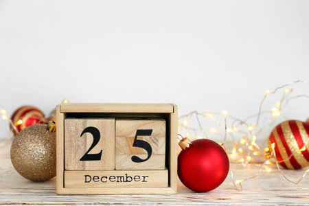 Wooden block calendar and decor on table. christmas count down