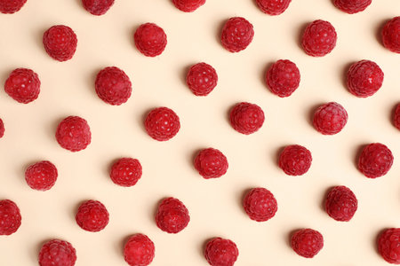 Flat lay composition with ripe aromatic raspberries on color backgroundの写真素材