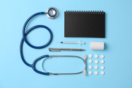 Flat lay composition with medical equipment and pills on color backgroundの写真素材