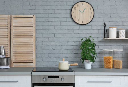 Modern kitchen interior with new furniture and different utensils
