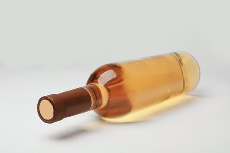 Bottle of expensive white wine on light backgroundの写真素材