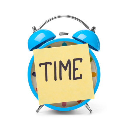 Alarm clock and sticky note with word TIME on white backgroundの写真素材