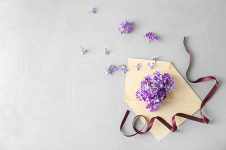 Flat lay composition with beautiful blossoming lilac on light background. spring flowersの写真素材