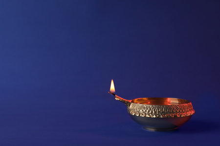 Diwali diya or clay lamp on color backgroundの写真素材