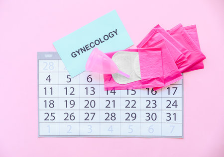 Flat lay composition with calendar and feminine hygiene items on color background. Gynecological careの写真素材