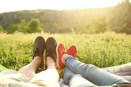 Young couple resting in wilderness. camping seasonの写真素材