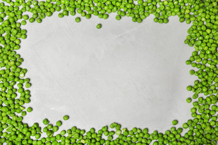 Flat lay composition with frozen peas on gray background. vegetable preservationの写真素材