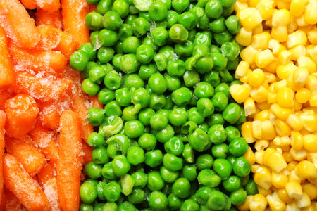 Mix of frozen vegetables as background, top viewの写真素材