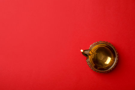 Diwali diya or clay lamp on color background, top viewの写真素材