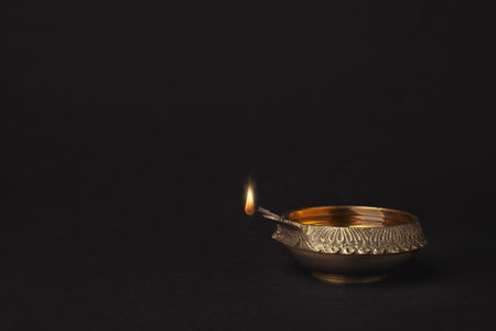Diwali diya or clay lamp on dark backgroundの写真素材