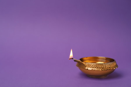 Diwali diya or clay lamp on color backgroundの写真素材