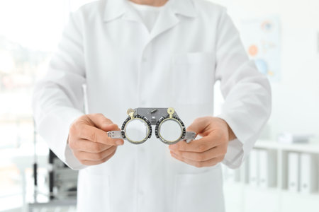 Ophthalmologist with trial frame in clinic, closeupの写真素材