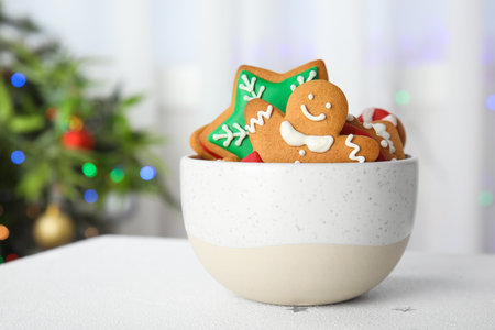 Bowl with tasty homemade Christmas cookies on tableの写真素材