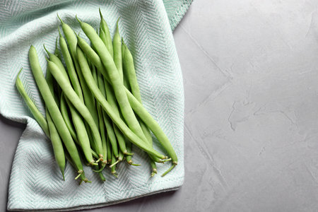 Pile of fresh green beans on towel, top viewの写真素材