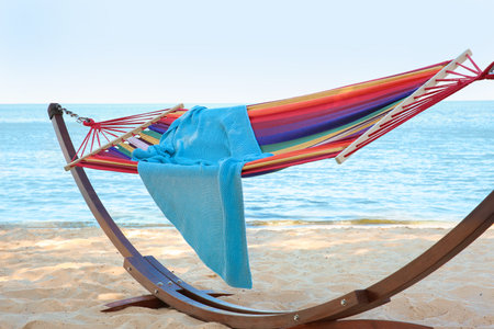 Colorful hammock with blanket at seaside. summer holidaysの写真素材