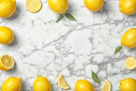 Flat lay composition with lemons on marble backgroundの写真素材