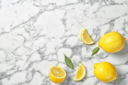 Flat lay composition with lemons on marble backgroundの写真素材