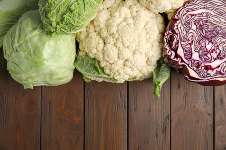 Flat lay composition with different cabbages on wooden backgroundの写真素材