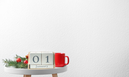 Wooden block calendar and festive decor on table. christmas count downの写真素材