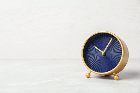 Modern clock on light background. time managementの写真素材