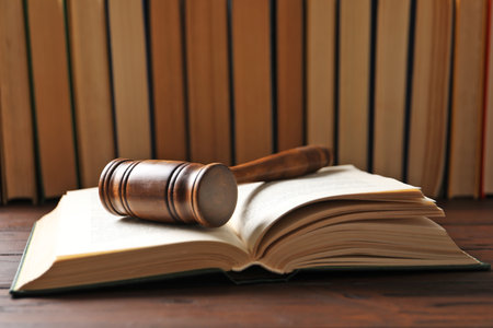 Wooden gavel and books on table. law conceptの写真素材